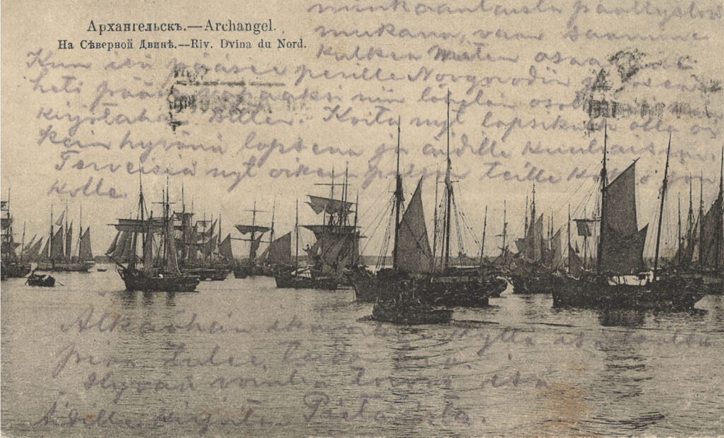 Vanhassa kuvassa purjelaivoja satamassa.