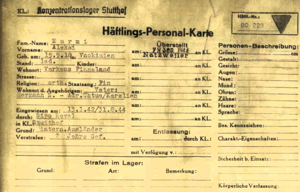 Kellansävyinen kortti, johon on kirjoitettu runsaasti tekstiä kirjoituskoneella. Otsikot ja ohjerivit ovat saksaksi.